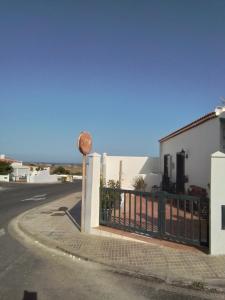 a fence in front of a white building at Casa Rafter Abades in Abades