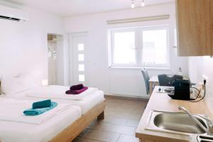 Voodi või voodid majutusasutuse Weingut Guttmann - Apartment Schwalbennester toas
