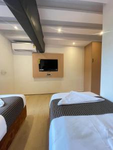 Postel nebo postele na pokoji v ubytování Hotel Winton