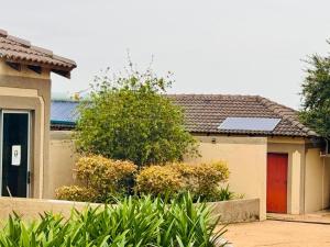 a house with a solar panel on top of it at Soaring Summit Lodge in Ronaldsey