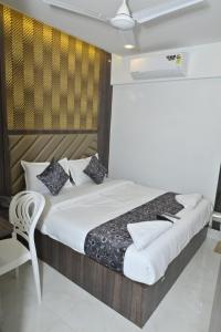 Postel nebo postele na pokoji v ubytování HOTEL S P Terminal-2