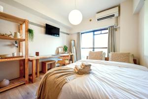 Letto o letti in una camera di New! Japandi 3 1BR in Prime Location-1 min to STN
