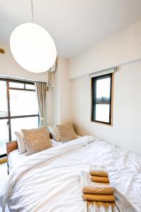 Letto o letti in una camera di New! Japandi 3 1BR in Prime Location-1 min to STN