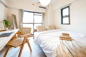 Letto o letti in una camera di New! Japandi 3 1BR in Prime Location-1 min to STN