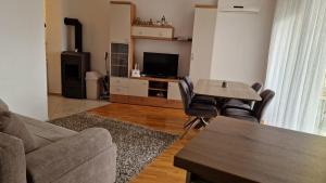 a living room with a couch and a table at Princess in Brodarica
