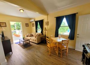 a living room with a table and a couch at Mi Pana Apartments in Vieques
