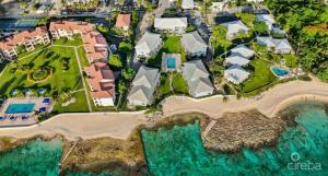 an aerial view of a house on a beach at 7Mile Beachfront Apartment in George Town +12 photos