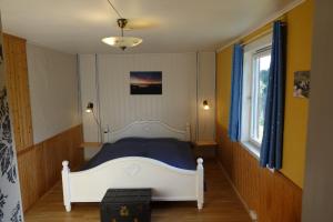 Postel nebo postele na pokoji v ubytování Guesthouse Hamran
