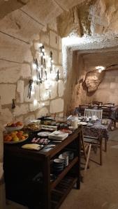 a kitchen with a table with food on it at Le Petit Hureau in Saumur