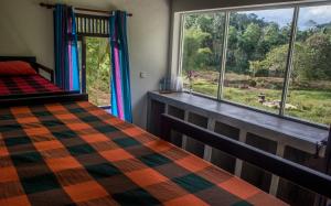Postel nebo postele na pokoji v ubytování Sinharaja Hostel + 37 fotografií