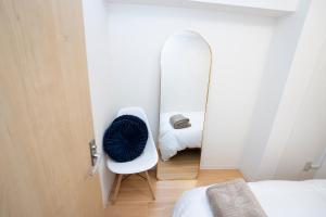 Postel nebo postele na pokoji v ubytování 花宿新宿 HANAYADO SHINJUKU