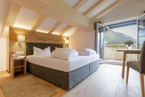 Posteľ alebo postele v izbe v ubytovaní Familotel Kaiserhof - Families only + 28 fotografií
