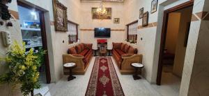 Posezení v ubytování Appartement Riad 5min à pied de l'aéroport