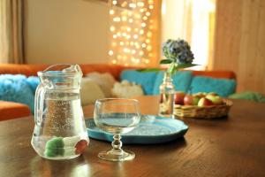 a table with a glass jar of water and a plate at TUTTO House super choice in Frýdlant nad Ostravicí