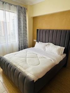 Postel nebo postele na pokoji v ubytování Pendo lux homes