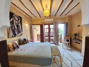 Postel nebo postele na pokoji v ubytování Riad Mumtaz Marrakech