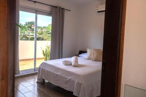 Voodi või voodid majutusasutuse Habitaciones con amplia terraza a minutos del centro toas