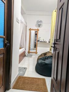 Postel nebo postele na pokoji v ubytování Rich Grove Inn