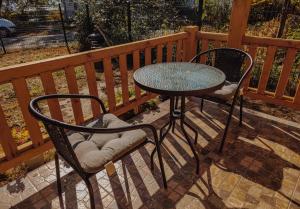 a table and two chairs sitting on a patio at Brvnara Mila Vinci in Golubac +15 photos