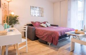 Ένα ή περισσότερα κρεβάτια σε δωμάτιο στο Charmant appartement T1 Mâcon