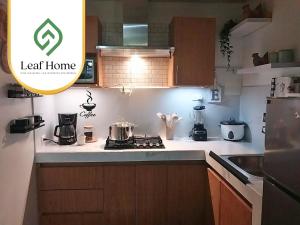 Η κουζίνα ή μικρή κουζίνα στο Alajuela Leaf Home