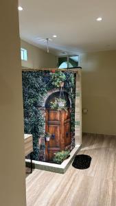 a wall with a large door in a brick wall at LOL-HA Hotel Boutique in Cancún