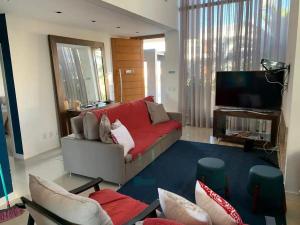 Χώρος καθιστικού στο Verão Perfeito no Condomínio Malibu!