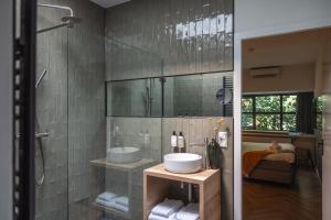 a bathroom with a sink and a shower at Badhuis Hotel in Utrecht