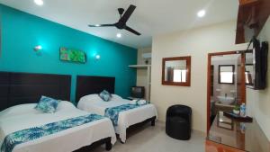 Katil atau katil-katil dalam bilik di Hotel San Miguel