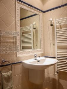 a bathroom with a sink and a mirror at Las Bodegas De Claveria in El Humo de Muro +79 photos