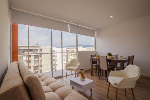 a living room with a couch and a table at Penthouse en Pitalito in Pitalito