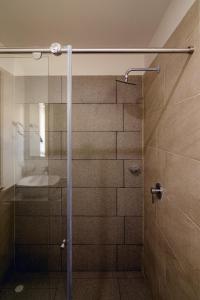 a shower with a glass door in a bathroom at Penthouse en Pitalito in Pitalito +8 photos