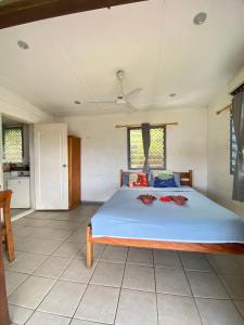 a bedroom with a large bed in a room at Room With A View & Apartment Style in Port Vila