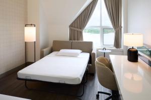 Voodi või voodid majutusasutuse Delta Hotels by Marriott Fredericton toas