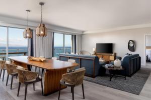 a living room with a table and chairs and a living room at The Westin Maui Resort & Spa, Ka'anapali in Lahaina