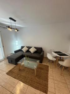 a living room with a couch and a table at Casa Valen Costa Calma in Costa Calma