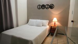 Cama o camas de una habitación en Cali te espera