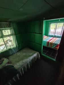 En eller flere senge i et værelse på Hospedaje refugio en el Bosque