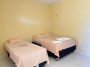 En eller flere senge i et værelse på Residencial Negroni