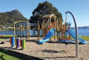 a playground with a slide at Stuart's in Whangarei Heads