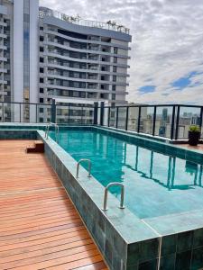 Πισίνα στο ή κοντά στο Studio com piscina a 1 minuto a pé do Metrô Brooklin