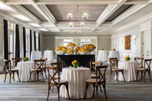 a ballroom with tables and chairs and a room with tables and chairsktop at The Ritz-Carlton Naples, Tiburon in Naples