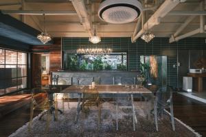 a dining room with a table and chairs at Ocean View Riad Jeju in Jeju