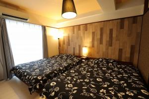 Fukuoka Condominium客房内的一张或多张床位
