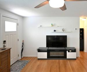 a living room with a flat screen tv at Charming Florida cottage in Largo