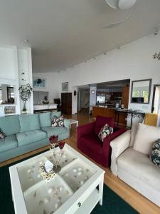 a living room with couches and a coffee table at Dream House -Water Lily in Horseshoe Bay