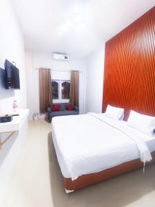 Postel nebo postele na pokoji v ubytování D'Rey Hotel