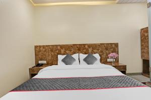 Postel nebo postele na pokoji v ubytování Hotel O Kiwi International