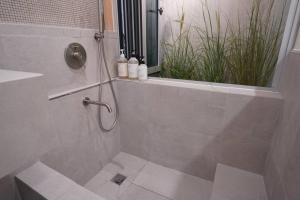 a bathroom with a shower stall with a window at Unwadang Private Luxury Hanok House in bukchon in Seoul +36 photos