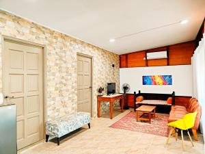 a living room with a couch and a table at PULANG RESORT in Setiu